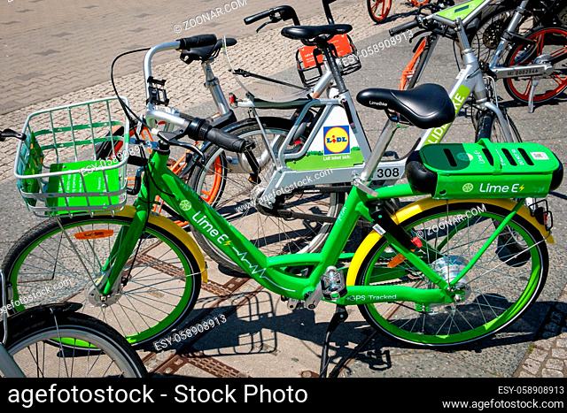 Berlin, Germany - june 2018: Many electric bicycles of public bike sharing company LimeBike in Berlin, Germany