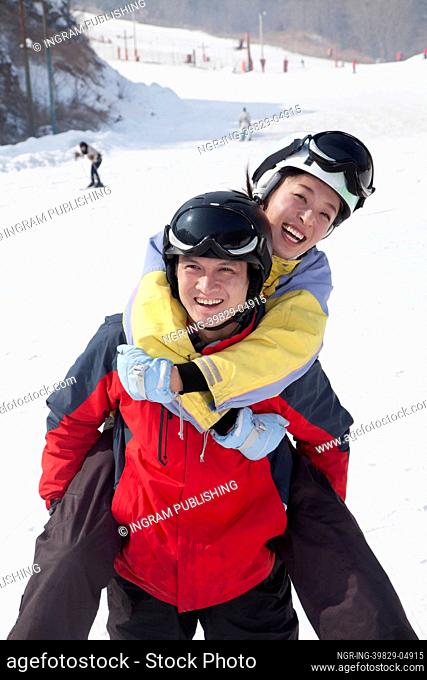 Smiling Couple in Ski Resort