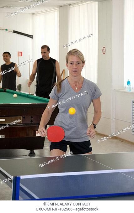 In the Cosmonaut Hotel crew quarters in Baikonur, Kazakhstan, Expedition 3637 Flight Engineer Karen Nyberg of NASA gets in a round of Ping-Pong May 22 as she...