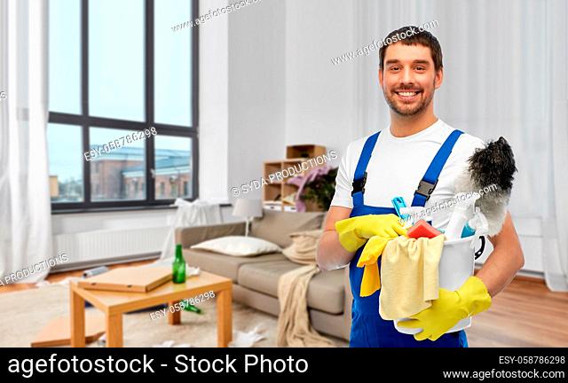 male cleaner with cleaning supplies at home