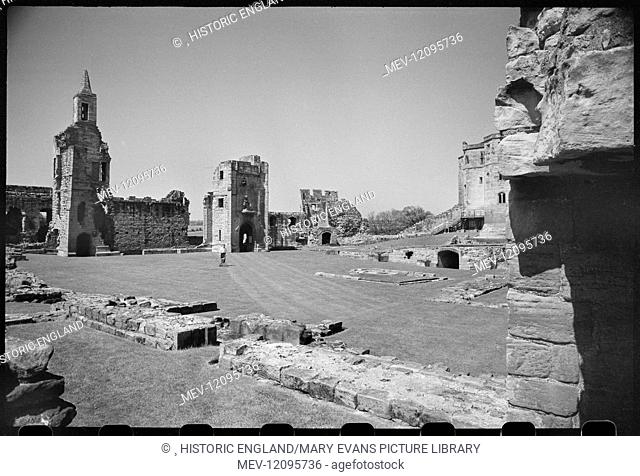 An interior view of Warkworth Castle, showing the west range and a partial view of the caslt donjon in the north, seen from the Outer Ward in the south of the...