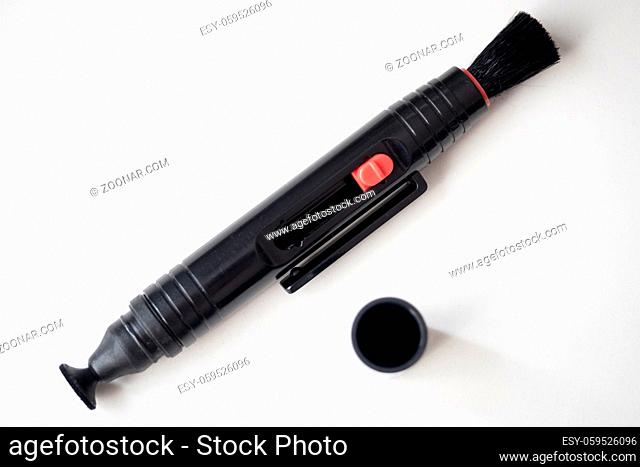 2 in 1 pen for cleaning the front element of a camera lens
