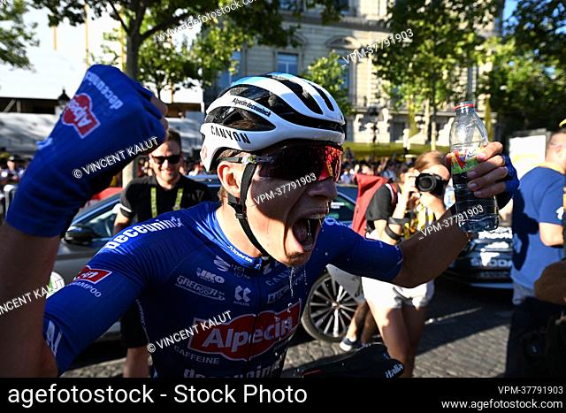 Belgian Jasper Philipsen of Alpecin-Deceuninck celebrates after winning stage 21, the final stage of the Tour de France cycling race