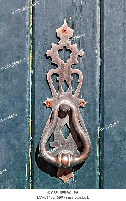 Old ornamental knocker hammer