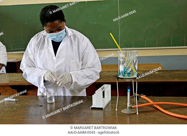 School girl doing experiment in school lab, St Mark's School, Mbabane, Hhohho, Kingdom of Swaziland