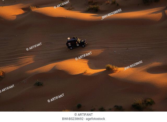 Jeep during the desert rally Erg Oriental in the North Sahara at sunset, Tunisia, Sahara