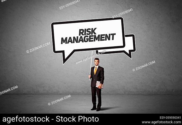 Young business person in casual holding road sign with RISK MANAGEMENT inscription, new business idea concept
