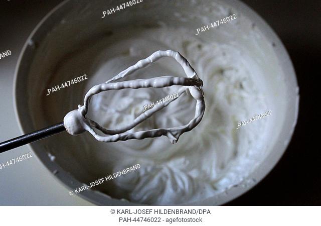 A mixer rests on the edge of a bowl with whipped egg white in Kaufbeuren, Germany, 5 December 2013. Christmas cookies are being prepared for the forthcoming...