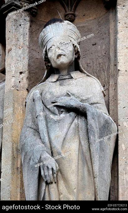 Saint Marcel statue on the portal of the Saint Germain l'Auxerrois church in Paris, France