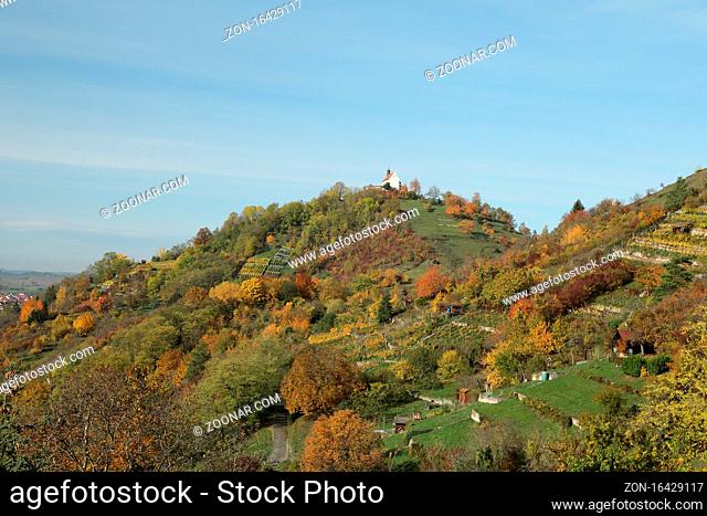 Autumnal landscape with indian summer colours in Wurmlingen, Germany with the chapel St. Remigius (Wurmlinger Kapelle) Germany