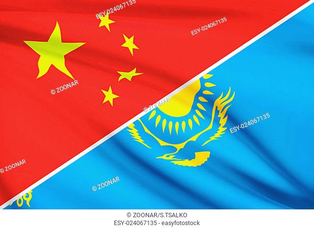 Flags of China and Republic of Kazakhstan blowing in the wind. Part of a series