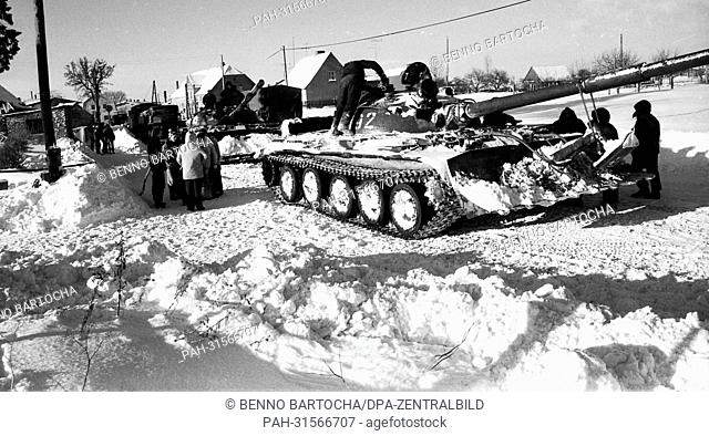 Panzer with sliding plate from the Soviet garrison Neustrelitz cleared the street in the village of Lebbin on 03.01.1979 after heavy snowfall