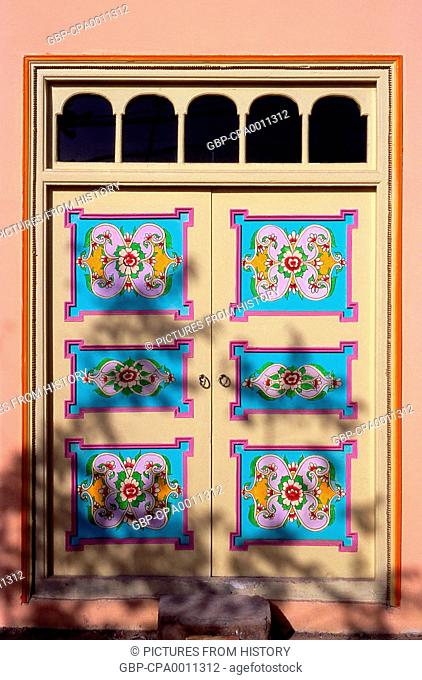 China: Brightly decorated house doors in Old Kuqa, Xinjiang Province