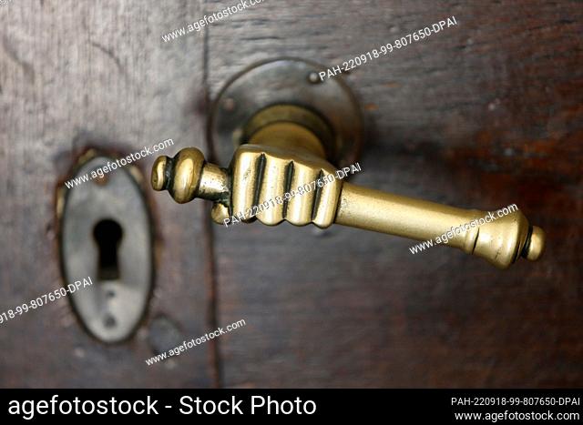 18 September 2022, Saxony-Anhalt, Huy: View of a door handle at the entrance to Huysburg Monastery. The origins of the Benedictine monastery date back to 1070