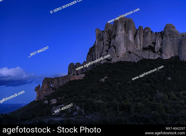 Montserrat west face and Roca Foradada seen from Sant Pau Vell de la GuÃ rdia in the blue hour (Barcelona province, Catalonia, Spain)