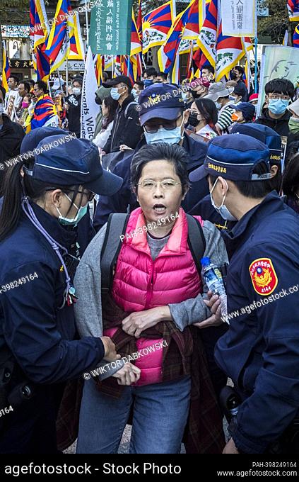 Police take out pro China activist as Tibetans and Taiwanese who support Tibetan freedom protest on the streets of Taipei