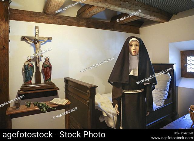 Mannequin in nun's traditional costume, chamber, crucifix, bed, Museum in der Klostermühle, Ulm-Söflingen, Baden-Württemberg, Germany, Europe