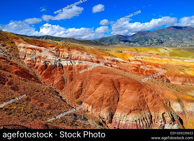 View of unrealy beautiful colorful clay cliffs in Kyzyl-Chin (Kisil-Chin) valley, Altai mountains, Russia. Summer landscape