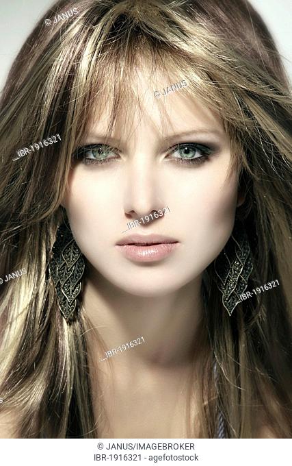 Young woman with dark blonde hair, beauty portrait