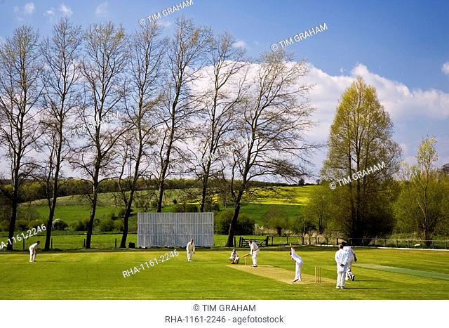 Locals play cricket, Swinbrook, The Cotswolds, United Kingdom