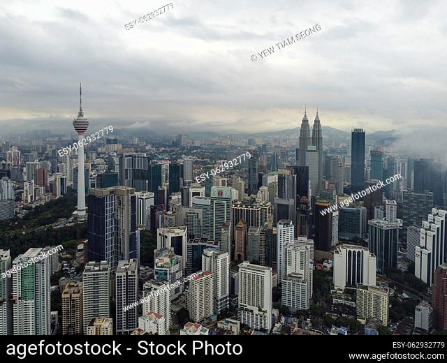 Bukit Bintang, Kuala Lumpur, Malaysia - Nov 12 2022: Aerial view KL tower and KLCC In misty day