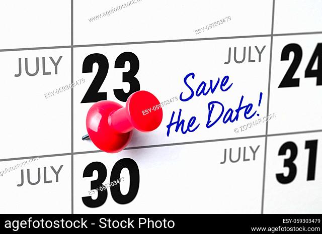 Wall calendar with a red pin - July 23