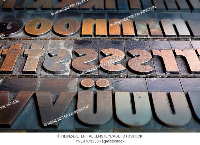Old wooden letters for a letterpress printing press, type case with a bold poster font
