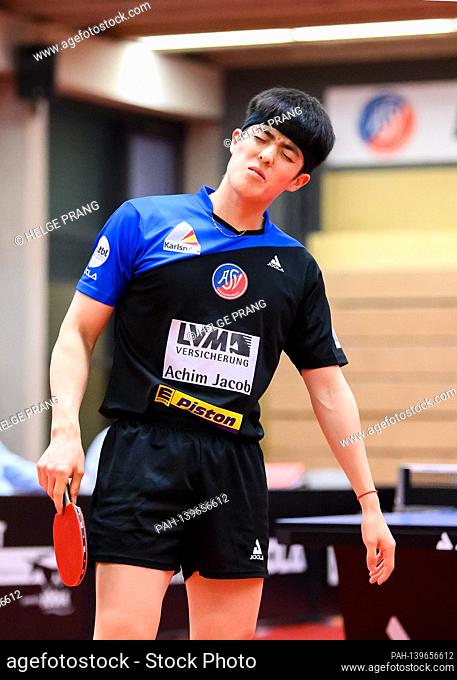 Dang Qiu (ASV Gruenwettersbach) disappointed after a lost set versus Hugo Calderano (Ochsenhausen, not in the picture). GES / table tennis / 1