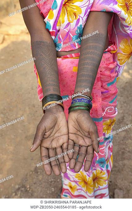 Tattoos painted on the arms of a tribal woman. Santhal tribe. Jarkatand village, Bokaro district, Jharkhand