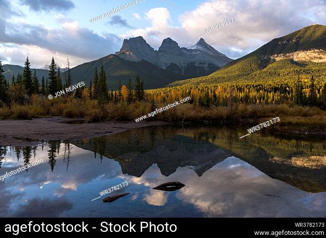 Colourful sunrise over Three Sisters at Policeman Creek in autumn, Canmore, Banff, Alberta, Canadian Rockies, Canada, North America