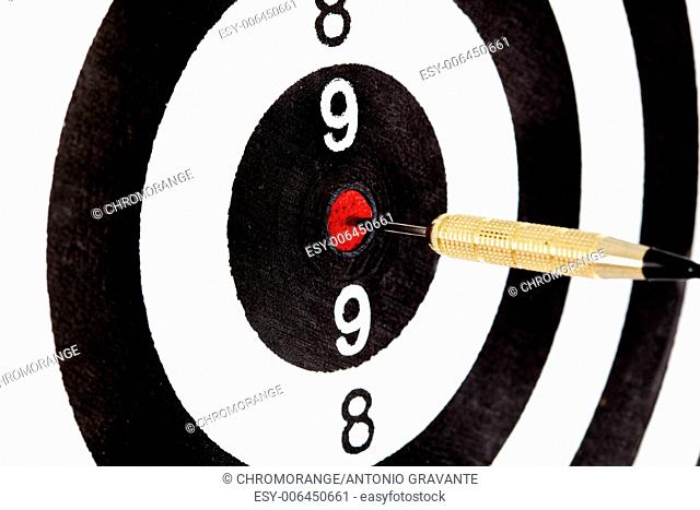 Bulls eye target with dart on white background