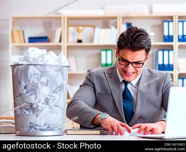 The businessman in paper recycling concept in office