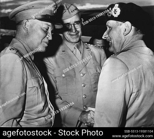 Interchange -- Turning from Gen. Dwight Eisenhower (left), Field Marshal Montgomery (right), British Chief of Ike. Gen Omar Bradley (center)