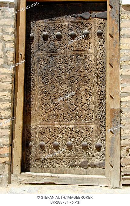 Fine carved wooden door Tash Hauli Palace Khiva Uzbekistan