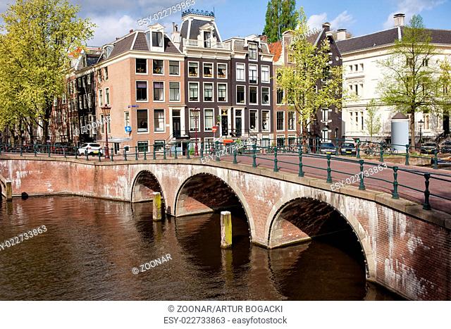 Bridge over Canal and Houses in Amsterdam