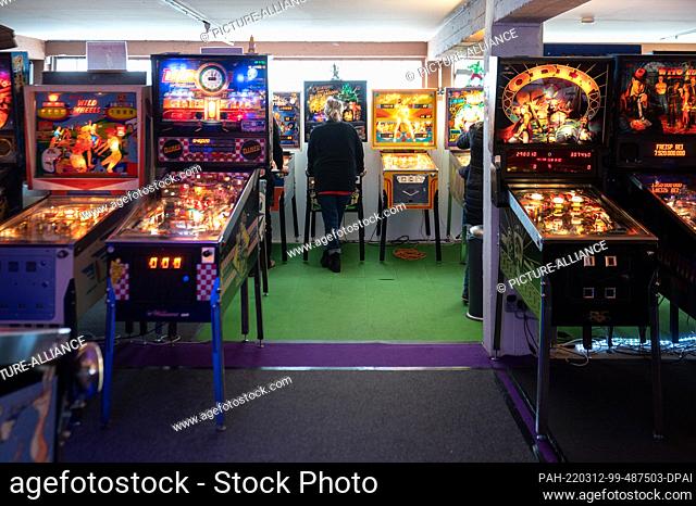 PRODUCTION - 05 March 2022, Hessen, Seligenstadt: A woman plays a pinball machine at the Pinball and Arcade Museum. The museum