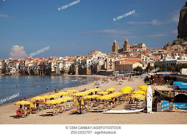 Scene from the the beach with the town at the background, Cefalu, Sicily, Italy, Europe