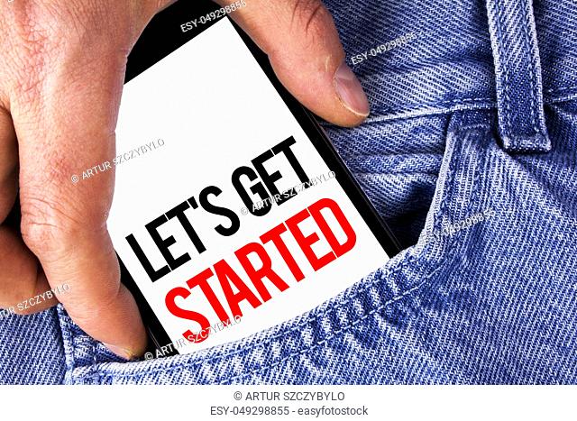 Conceptual hand writing showing Lets Get Started. Business photo showcasing beginning time motivational quote Inspiration encourage written Mobile phone holding...