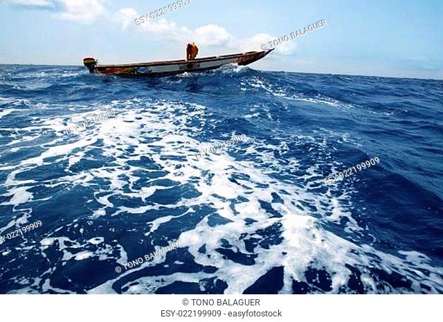 African motorboat in atlantic blue water