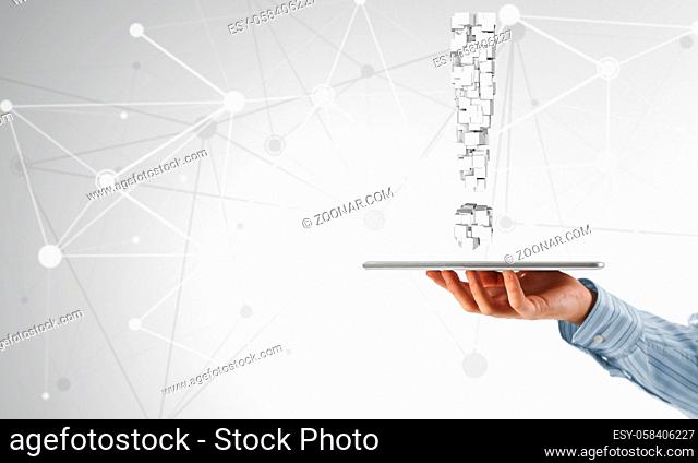 Hand of businessman showing tablet pc with exclamation mark on screen