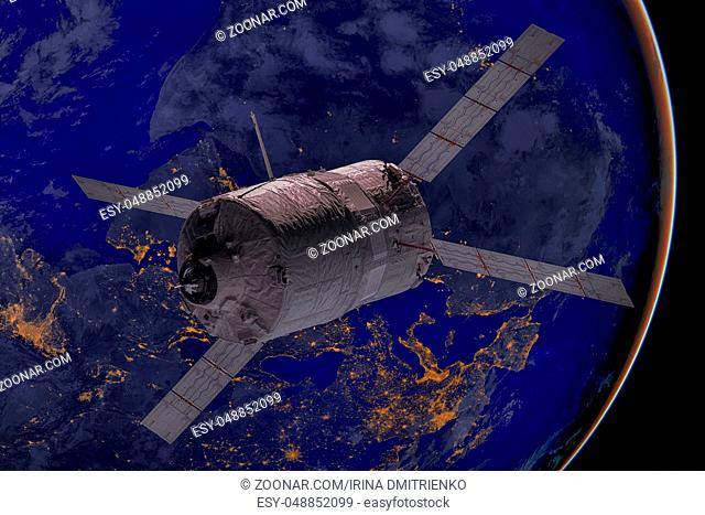 Cargo spacecraft - The Automated Transfer Vehicle over the planet Earth. Elements of this image furnished by NASA