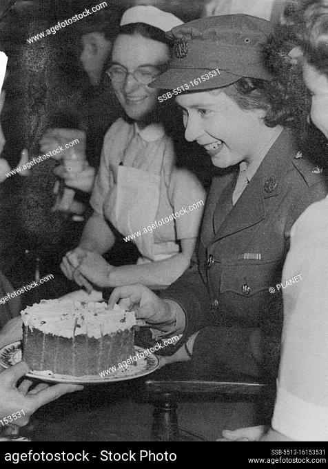 Princess Elizabeth Visits Royal College of Nursing. The Princess, with the members of the Student Nursing Association, takes a piece of cake at the tea which...