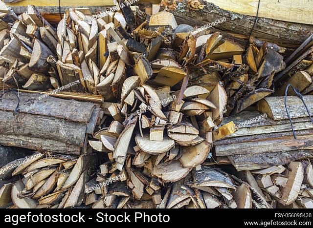 Bundle of split logs sold as firewood. Closeup