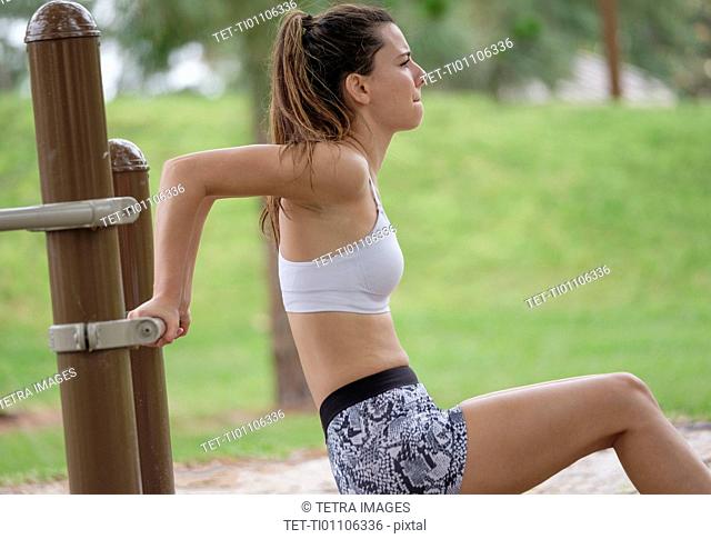 Young woman exercising in park
