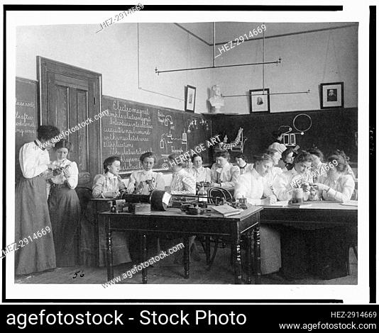 Group of young women studying electro-magnets in normal school, Washington, D.C., (1899?). Creator: Frances Benjamin Johnston