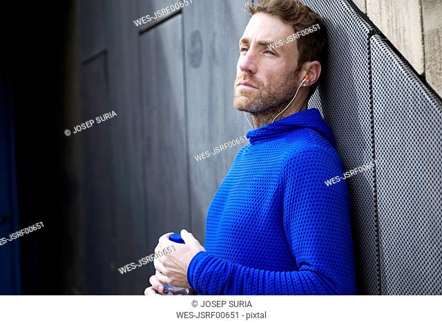Portrait of jogger with water bottle