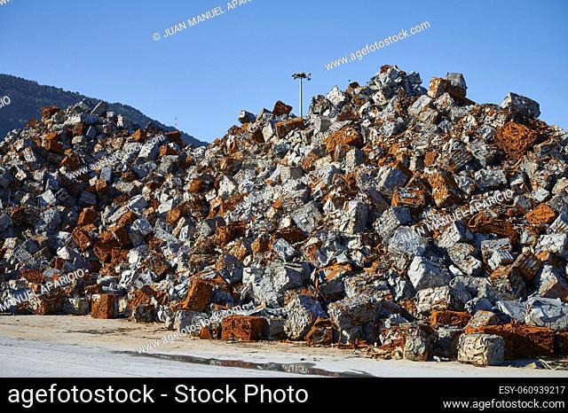 Scrap blocks prepared for export on the dock of the port of Bilbao