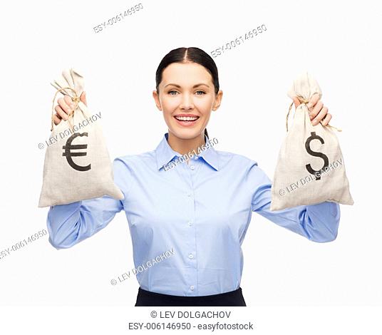 business and money concept - young businesswoman holding money bags with dollar and euro