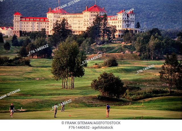 Foursome playing golf at the Mount Washington Hotel in Bretton Woods, New Hampshire, USA