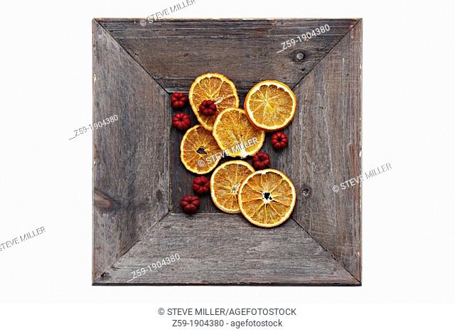clip image - dried orange slices and berries - christmas potpourri in wooden bowl